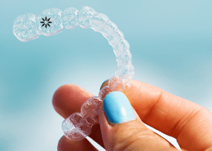 person holding invisalign